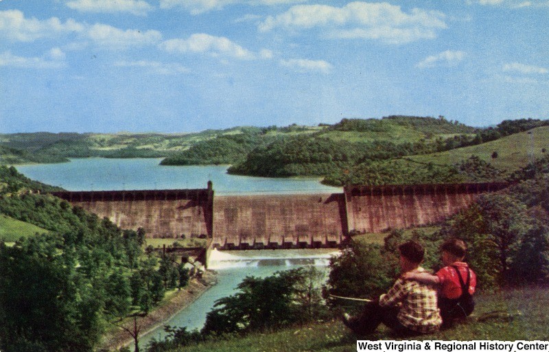 A postcard depicting children enjoying the view of Tygart Lake Dam