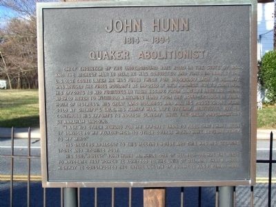 The historic marker for John Hunn is located near the Camden Friends Meeting House