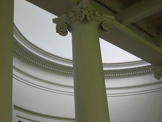 View from beneath the West Lawn colonnade of the entry columns, portico, and lunette of Pavilion IX