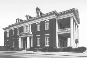 Current official building of the Cape Fear Club, at 206 Chesnut St. This brick Neoclassical Revival structure has been used by the men's club since it was constructed in 1913. (Cape Fear Historical Institute).