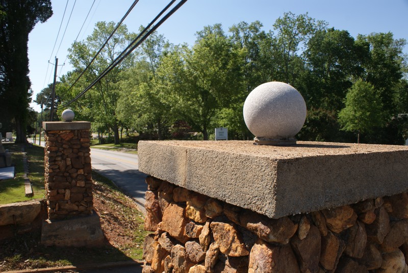 Original Carroll County Monument at the gates of the Carrollton City Cemetery entrance on Maple Street near Park Drive.