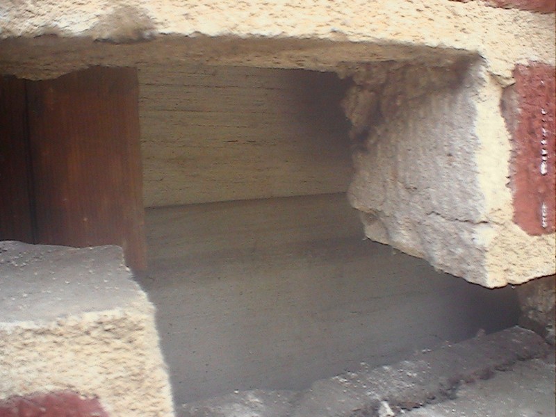 The 1885 wood sheathing under the 1930 brick sheathing.  Photo by Ernest E. Blevins, MFA, 14 July 2005.