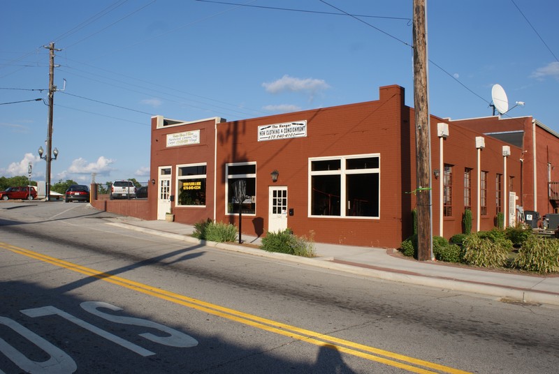 Site of former Greyhound Bus station on South Carroll Street 14 May 2015. The buildings were recently rehabilitated although not restored to Secretary of Interior Standards. One interior wall revealed the old bus station sign confirming the site.