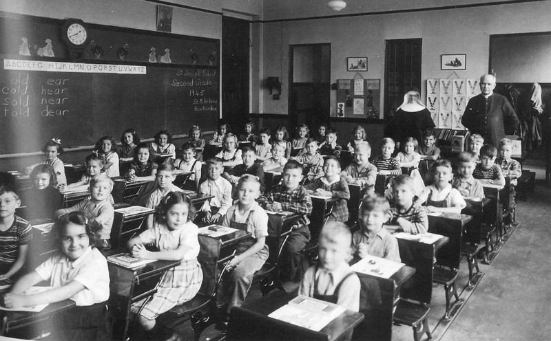 Sister Artena Schwarten and Father Henry Riordan with second grade pupils at St. Joseph's School, 1945.