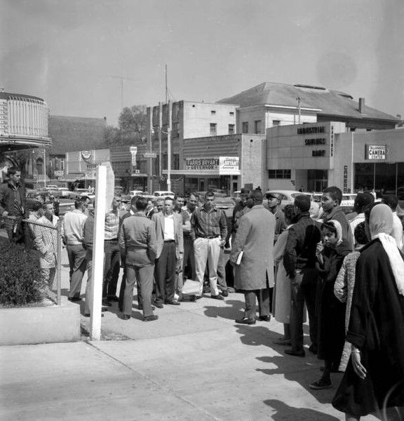 Whites confront sit-in demonstrators next to the old Florida Theater at 118 Monroe.