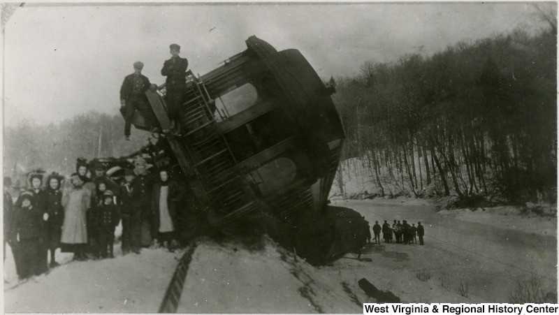 Survivors stand by a Western Maryland train that wrecked in between Thomas and Westernport. 1910 - 1912. 