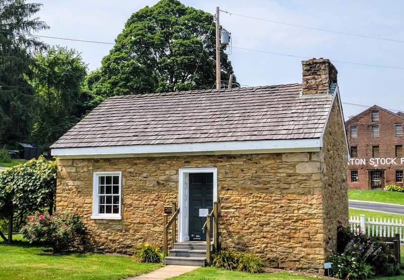 Outside view of West Overton's springhouse where Frick was born.