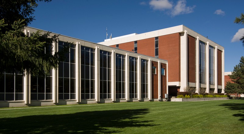 View of the back (north facing) side of the original Library 1964 structure and the 1970s four-story addition, August 26, 2016.