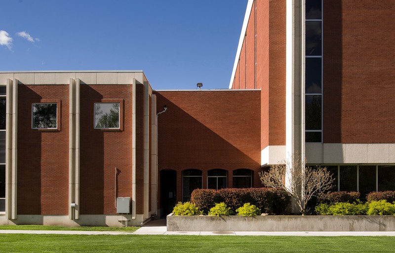 View of the back side of two story addition that connects the original 1964 structure to the 1970s four-story tower addition.