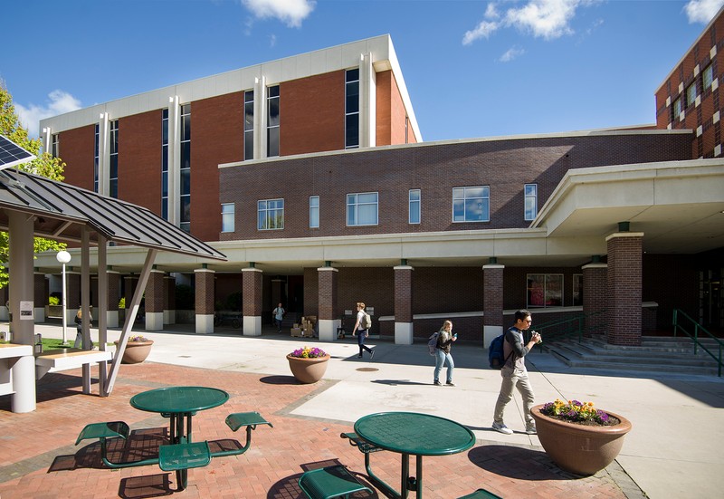 View of the front of the Library showing the 1995 addition as well as the solar charging station which was added in 2016. 