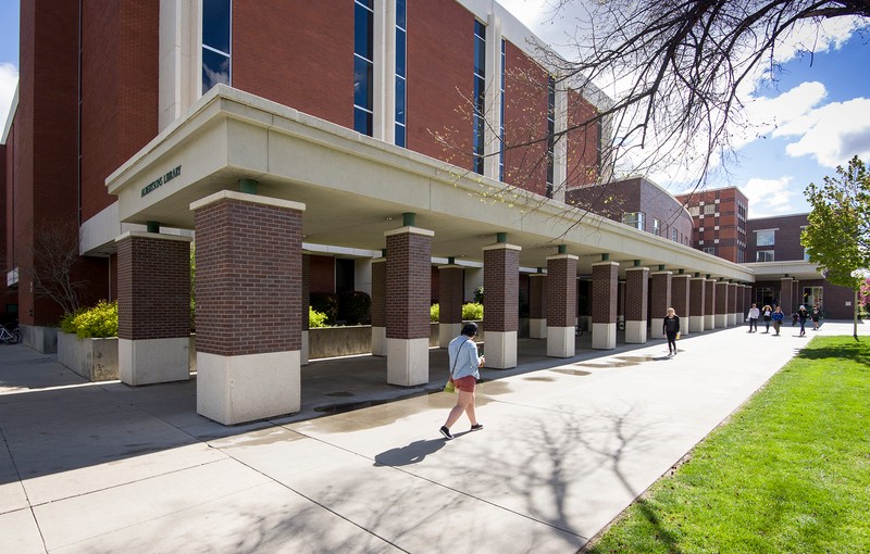 View of the southwest side of the Library showing the brick columned hall leading to the entrance.