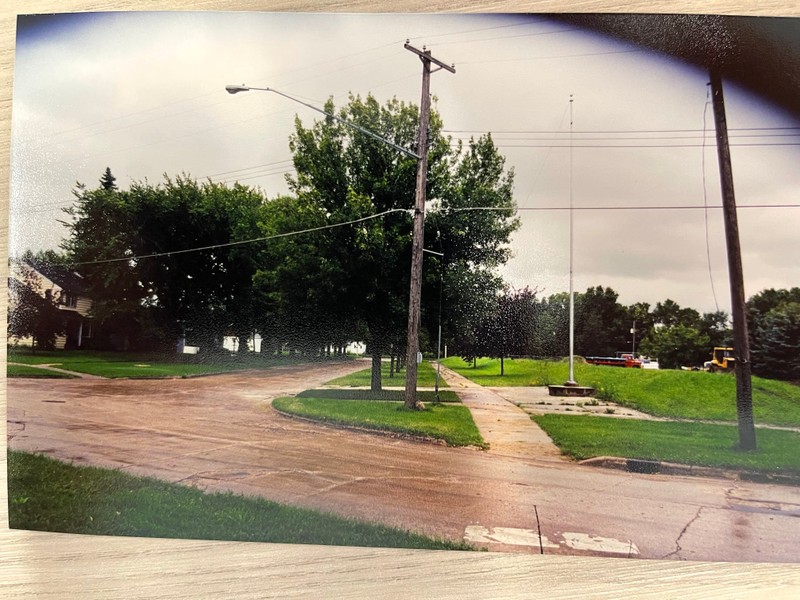 temporary dike tries to hold back flood waters filling streets.