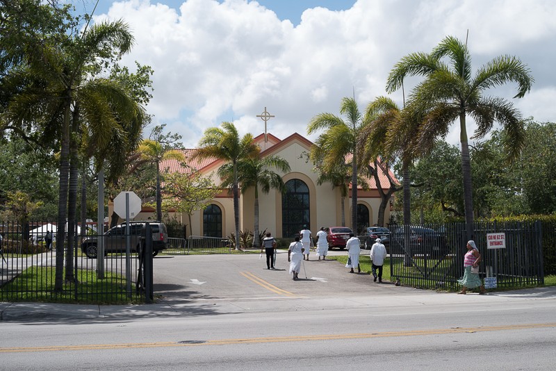 Notre Dame D'Haiti Catholic Church is centered in the creation story of Little Haiti due to the activism of Father Gérard Jean-Juste, who helped refugees gain legal status. aktivis nan Gérard Jean-Juste, ki moun ki te ede refijye jwenn estati legal.