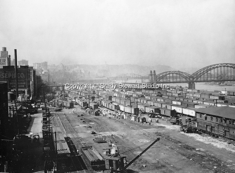This photo of Pittsburgh's Strip District was taken in 1925 before it became a fashionable neighborhood.  The McCullough Bridge, then known as the 16th Street Bridge, can be seen in the background.