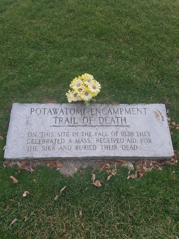 The marker reads "On this site in the fall of 1838, they celebrated a mass and received aid for the sick and buried their dead."