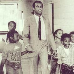 Panthers co-founder Huey Newton with students at the OCS