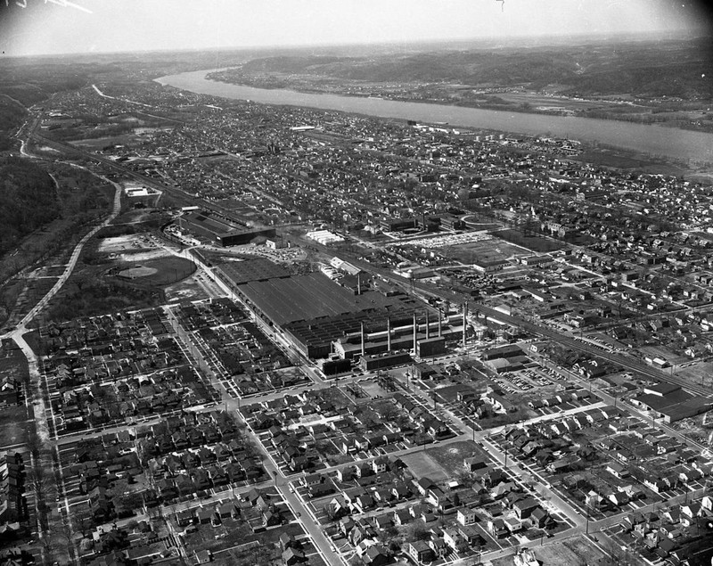 Houdaille Industries is visible behind the larger Owens-Illinois plant 