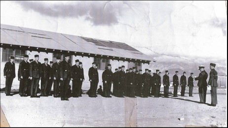 A Marine Corps Company standing in front of their barracks after the Marine took over the airport