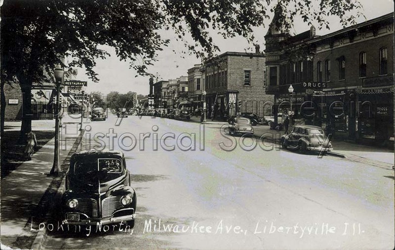 Looking north on Milwaukee Avenue, circa 1940. Lovell's Drug Store/Knight Building on the right.