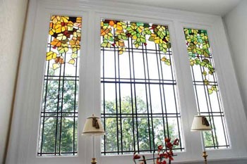 Original stained-glass detailing on the stairway landing