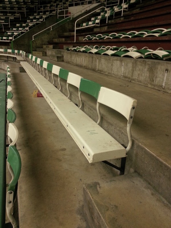 green and white steel bleacher seating