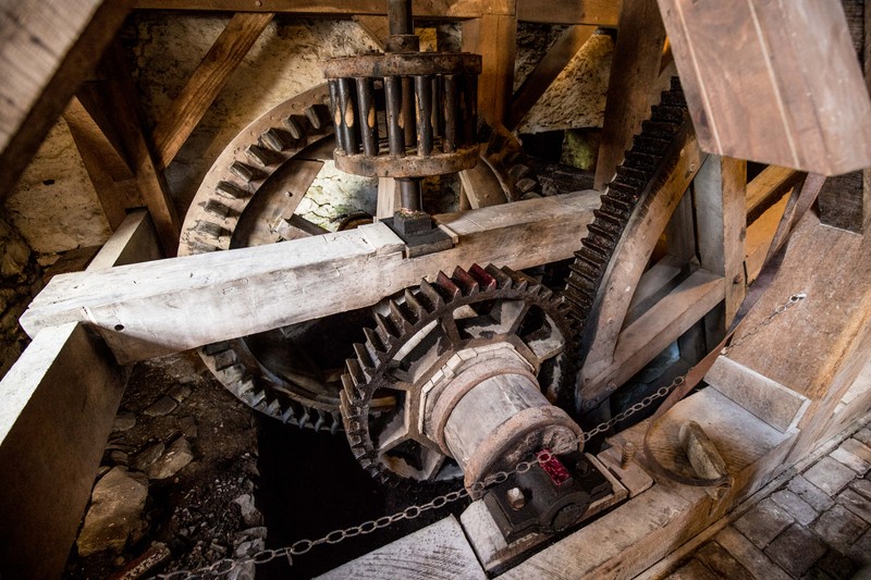 Close-up view of the wooden and iron gears.