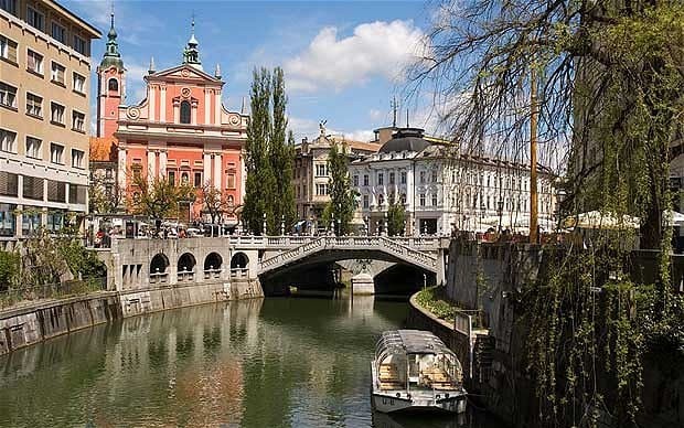 Pictured is the capital of Slovenia: Ljubljana. The city has a population of 300,000 and can be navigated on foot. There are many cafes and other activities to partake in. Dubbed "mini-Prague", you can see the Julian Alps when the skies are clear. 