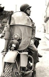 Darby on his classic motorcycle in North Africa