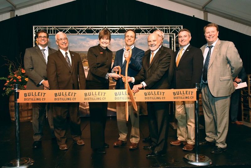 Tom Bulleit cutting the ribbon at his new Shelbyville distillery