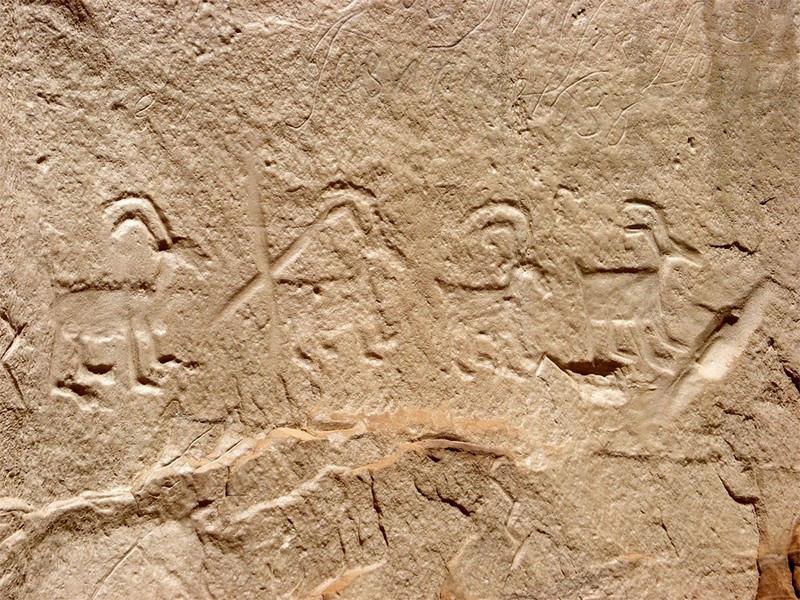 Petroglyphs in sandstone wall