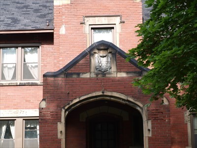 The Viall Lodge shield and covered entryway.