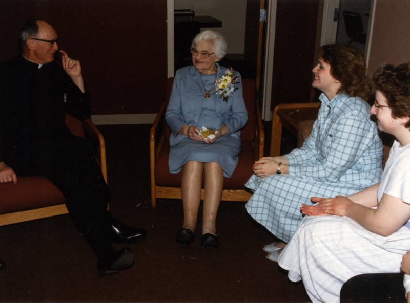 John P. Raynor, S.J. and Josephine Mashuda socialize with students at the dedication of Mashuda Hall, 1980
(“Department of Special Collections and University Archives, Marquette University Libraries, MUA_002785)