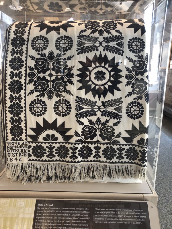 This is a two-piece double weave coverlet made of cotton and wool on a Jacquard loom. In the lower left corner it reads, "Wove at Newark, Ohio by G. Stich 1846."