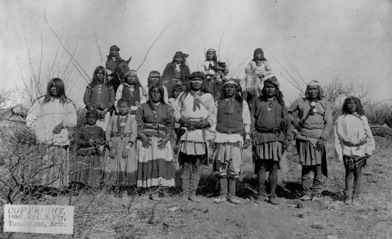 Geronimo stands with other Apache warriors, women, and children shortly before their surrender to Gen. Crook on March 27, 1886.