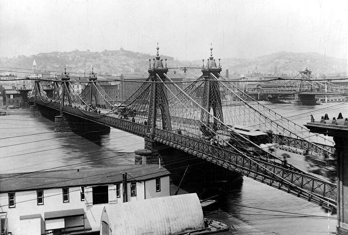 John Roebling's suspension bridge was replaced with a through truss bridge in 1892.