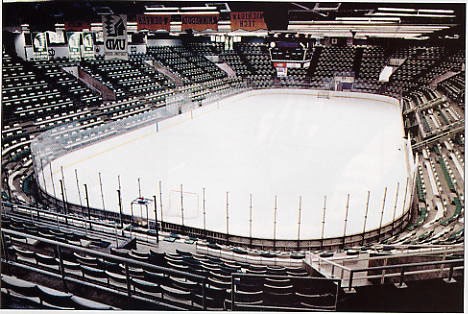 ice rink surrounded by arena-style seating.