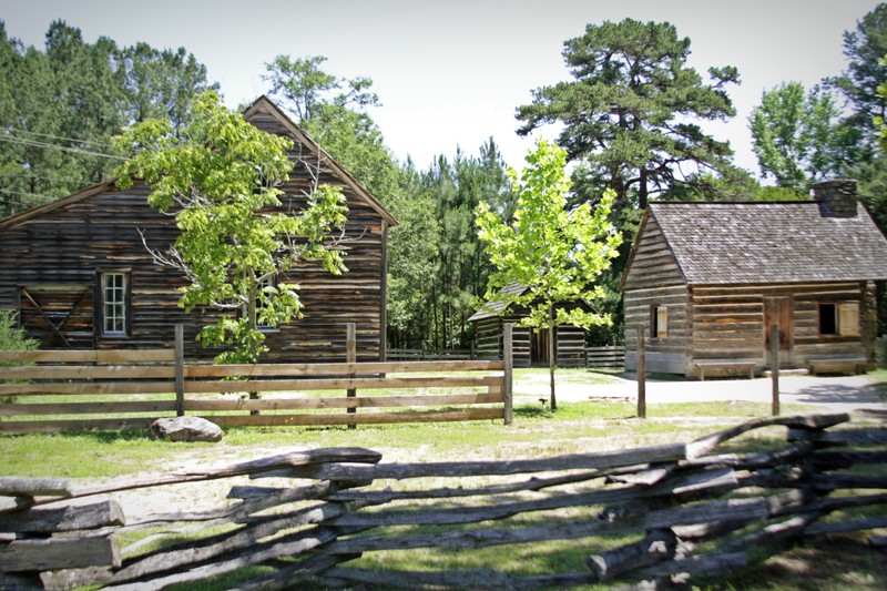 A view of the Bennett family compound. 
From left to right: Bennett House, smokehouse, kitchen house. 