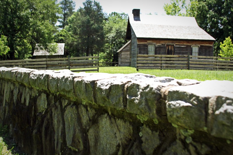 A view from outside the Bennett Farm.
From left to right: Smokehouse, Bennett House.