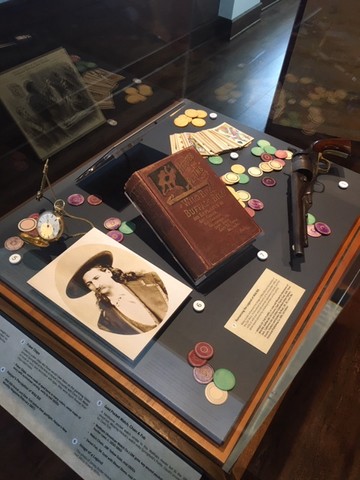 Case with items representing the shoot-out on the Springfield Square.