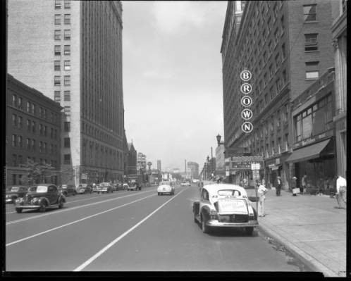 View down Broadway looking west between Third Street and Fourth Street, Louisville, Kentucky. The Brown Theatre can be seen on the right. ULPA R 50636, Royal Photo Company Collection, 1982.03, Photographic Archives, University of Louisville, Louisvil