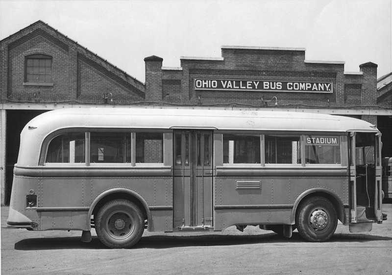 One of the Ohio Valley Bus Company's busses sitting in front of their bus barn located at the corner of 18th Street West and Adams Avenue.