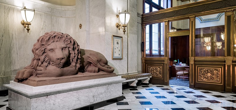 The recumbent lion now reposes inside the bank, safe from the deteriorating affects of the weather.