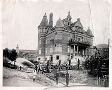 The house under construction in the 1870s.