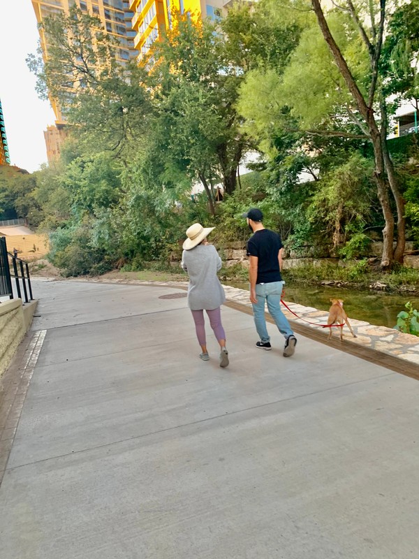 A couple walking along the paved trail with their pet. (September 2019)