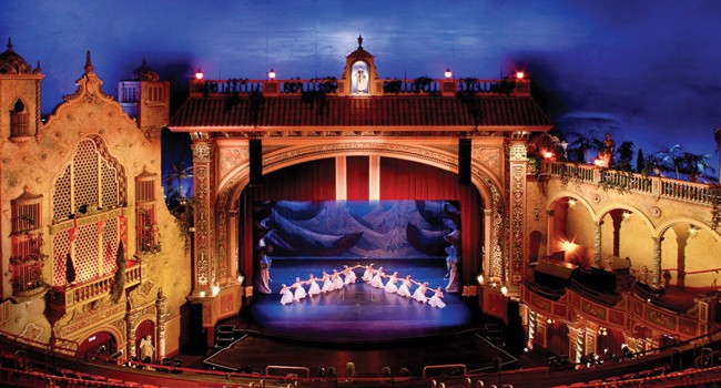 The Olympia was designed as an atmospheric theater, with the interior made to look like an outdoor amphitheatre in a Spanish garden. Image obained from Ocean Drive Magazine.