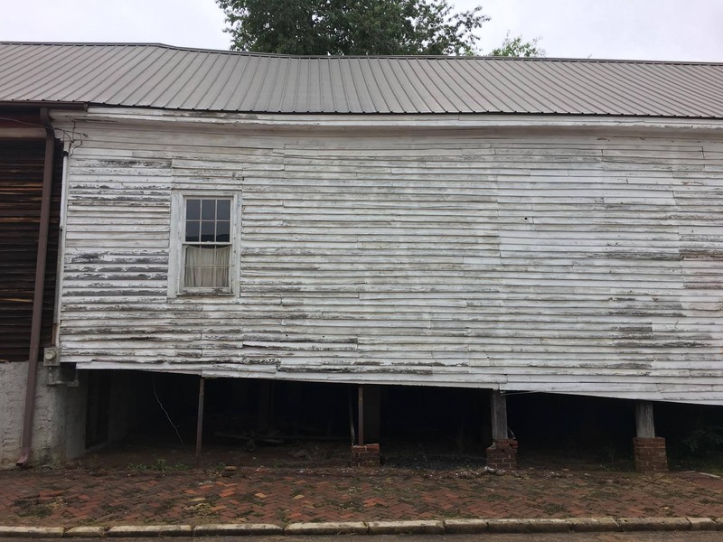 The middle section of the right side of the house