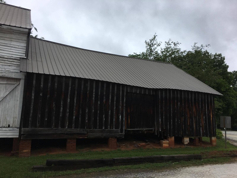The rear section of the right side of the house