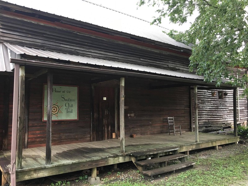 The rear section of the left side of the house