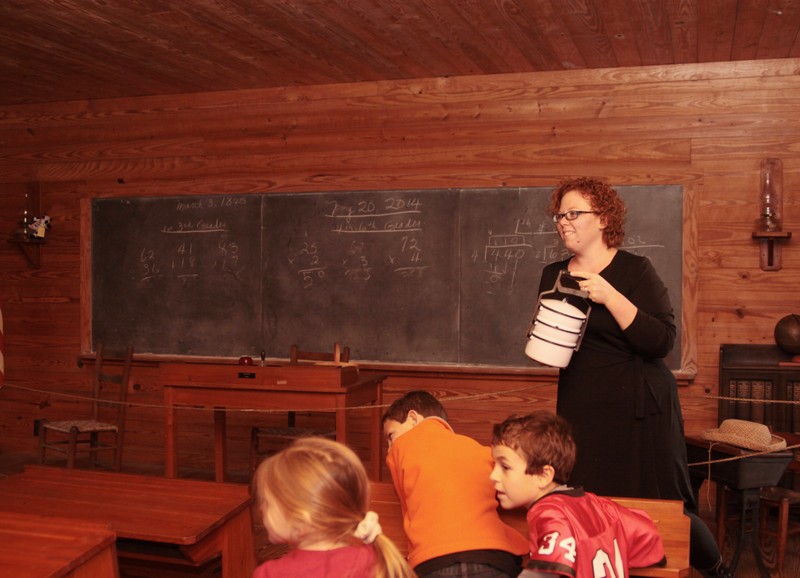 Showing students an old fashioned lunch box by Tana Carter