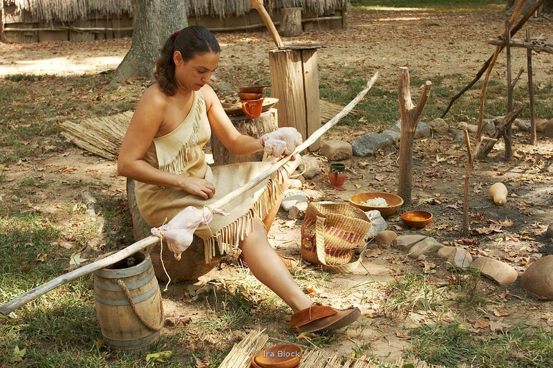 An interpretive guide representing the local Appomattoc tribe makes tools and other crafts found at the time. 